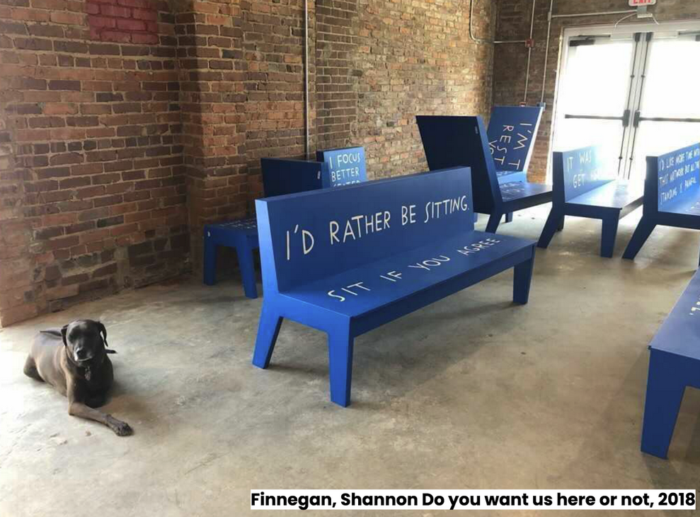cement floor room with blue benches